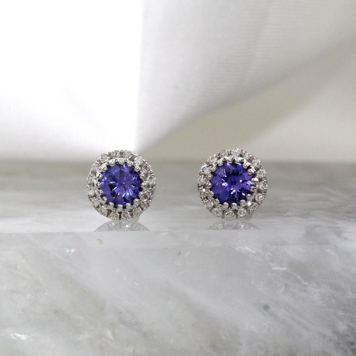 14K White Gold Tanzanite and Diamond Halo Style Stud earrings