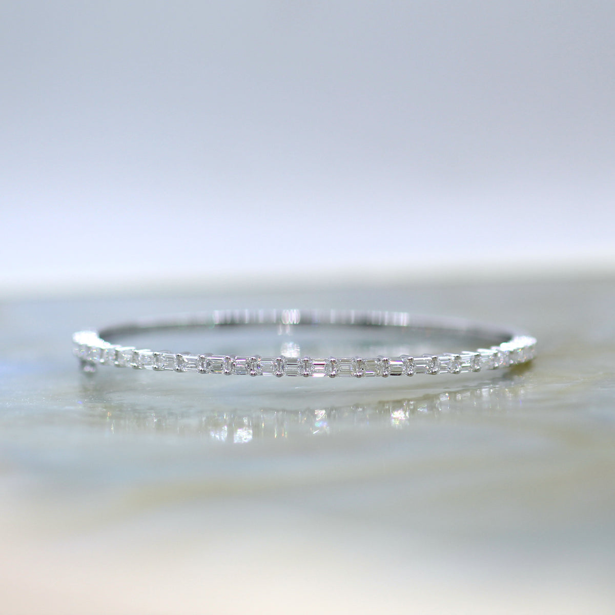 18K White Gold Hinged Bangle with Emerald Cut Diamonds
