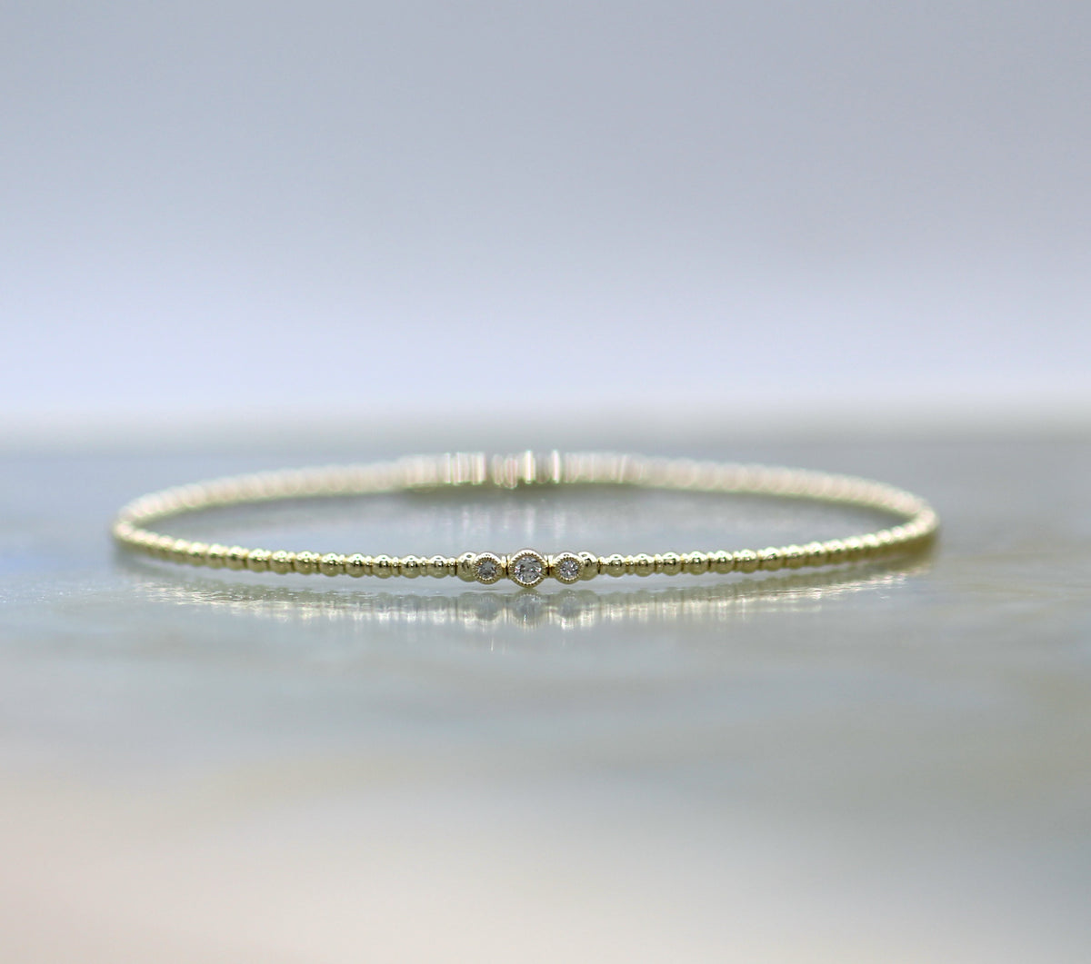 14K Yellow Gold Beaded Three Stone Diamond Flex Bangle Bracelet