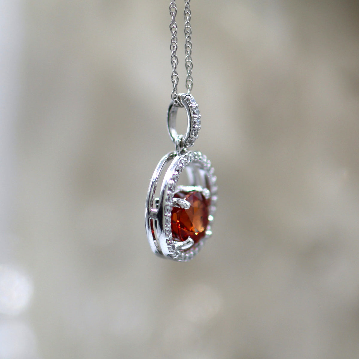 14K White Gold Floating Halo Orange Sapphire and Diamond Pendant